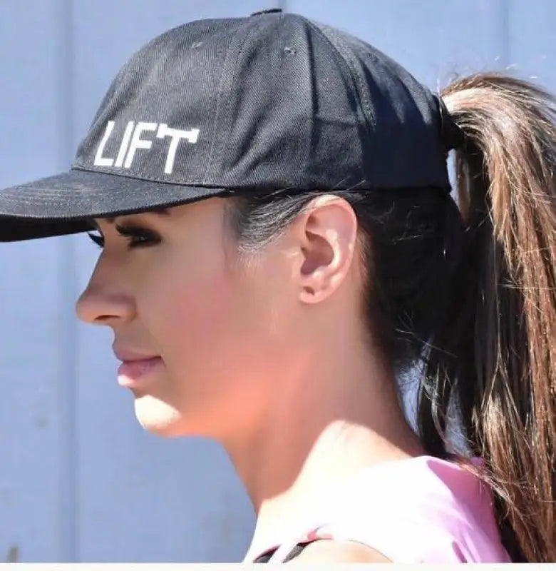 Black baseball cap with ’LIFT’ printed on it.