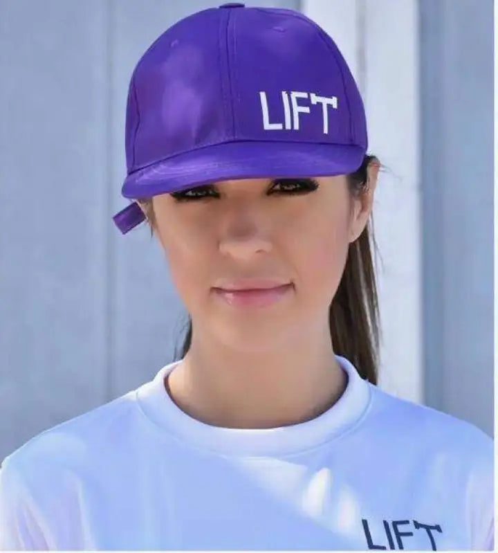 Purple baseball cap with ’LIFT’ written on the front.