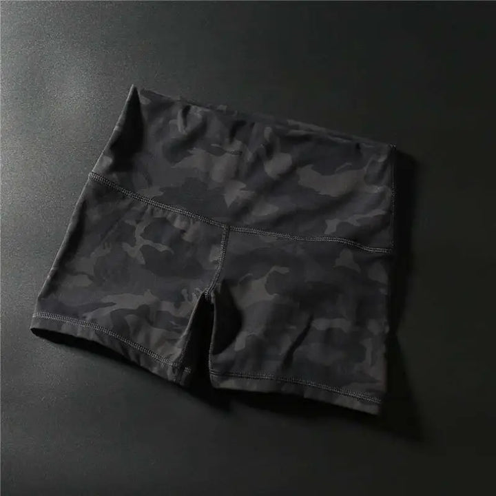 Black athletic shorts or compression shorts with a fitted, snug appearance.