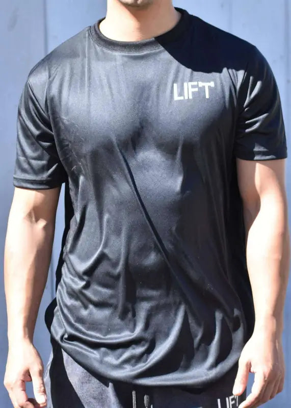 Black athletic t-shirt with ’LIFT’ printed in white letters on the chest.