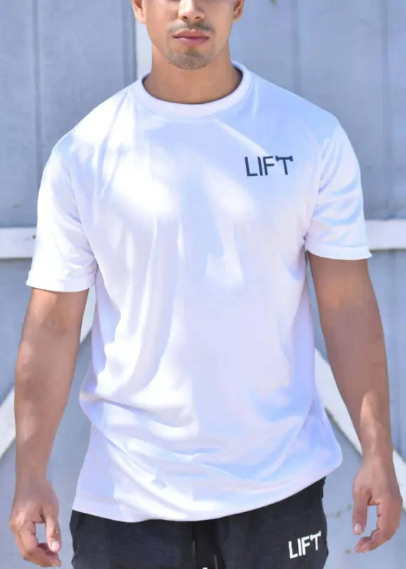 White t-shirt with ’LIFT’ printed on the chest.