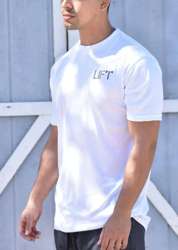 White t-shirt with ’LIFT’ printed on the chest.