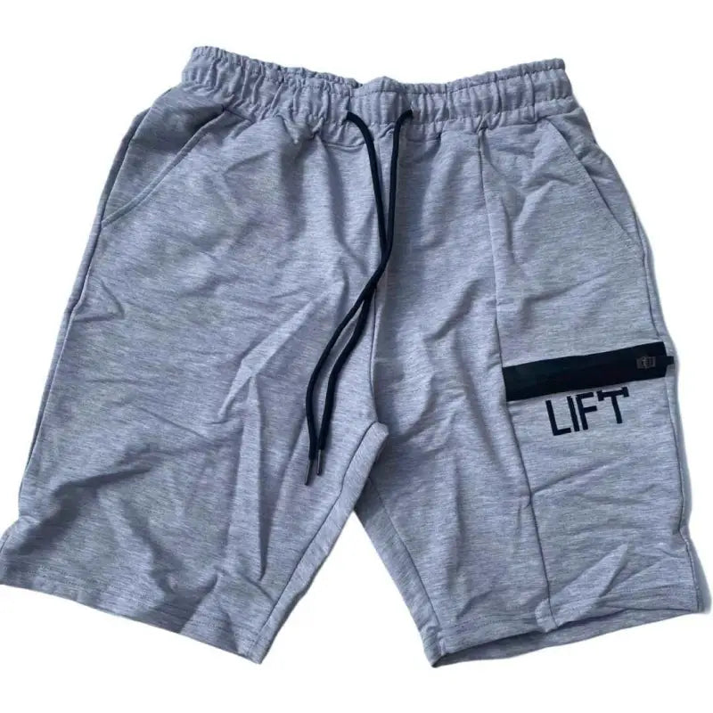 Gray athletic shorts with ’LIFT’ printed on the side pocket.